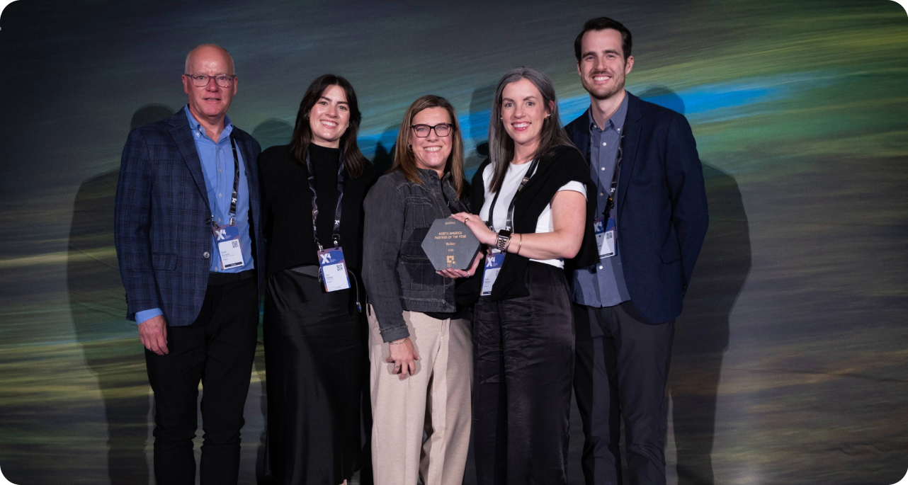 Image of team accepting the North America Partner of the Year award at X4 2026
