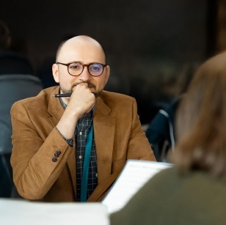 Walker xm advisor listening thoughtfully in strategy consulting meeting