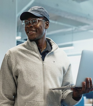 Walker xm technology consultant holding laptop